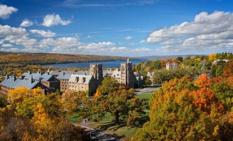 West campus in fall, with Cayuga Lake in the background.